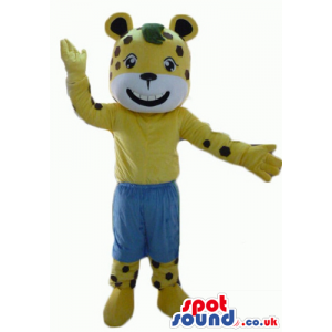 Mascot costume of a cheetah wearing blue shorts - Custom Mascots