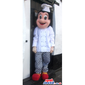 Cheerful chef mascot with white wear and checked trousers