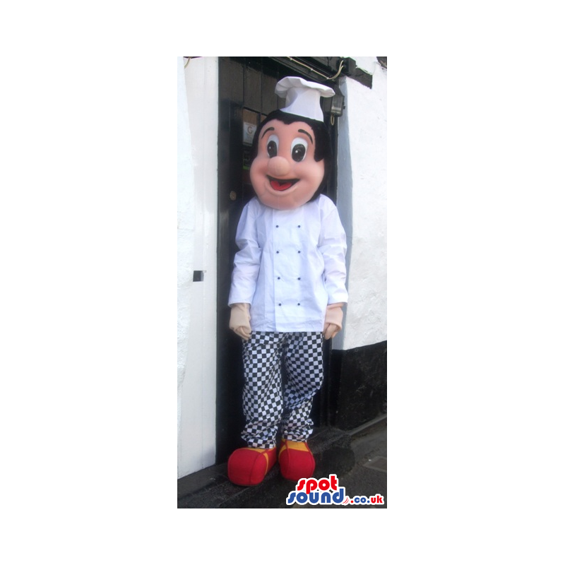 Cheerful chef mascot with white wear and checked trousers -