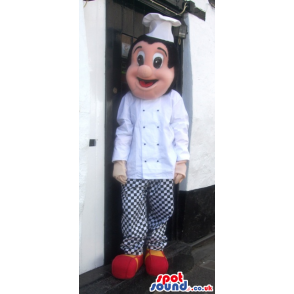 Cheerful chef mascot with white wear and checked trousers -