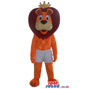 Orange lion with brown hair wearing white shorts and a yellow