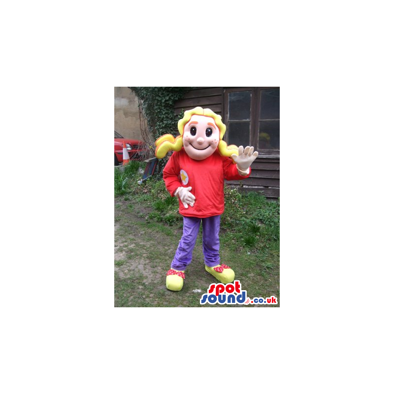 Delighted blond girl mascot with red blouse and violet trousers