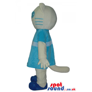 White cat dressed in lightblue dress and blue shoes with big