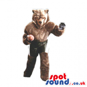 Determined brown bear mascot with the rugby ball and black