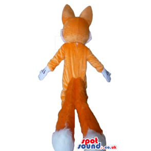 Smiling orange and white fox wearing red shoes - Custom Mascots