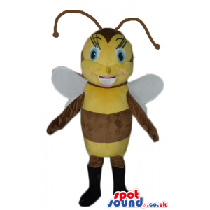 Smiling female bee with big blue eyes wearing black boots -
