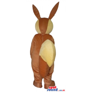 Brown and yellow rabbit with large teeth and a big nose. -