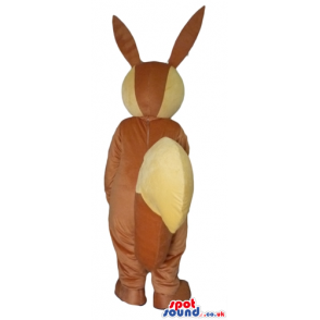 Brown and yellow rabbit with large teeth and a big nose. -