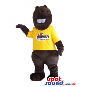 Dark brown beaver mascot with white teeth and yellow shirt -