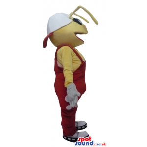 Yellow ant wearing white shoes and red gardener trousers -