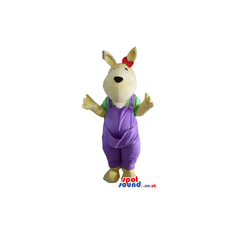 Beige dog wearing a green shirt, purple gardener trousers and