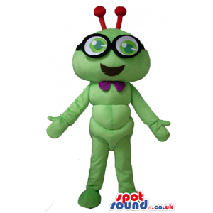 Smiling green bug with red antennae wearing glasses and a