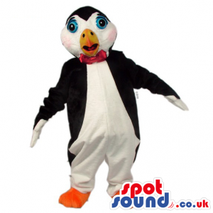 Black and white penguin with red bow tie, orange beak and feet