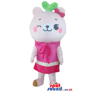 Pink female bear wearing a pink and white dress, a pink bow and