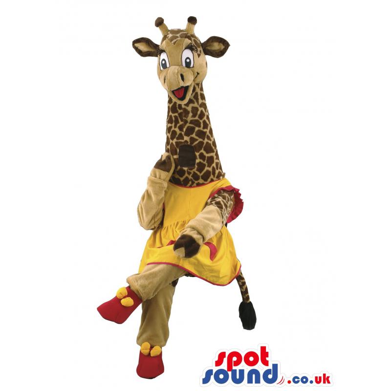 Giraffe mascot with beautiful yellow-pink frock with pink shoes