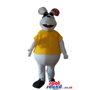 White rabbit wearing a yellow t-shirt and black trainers -