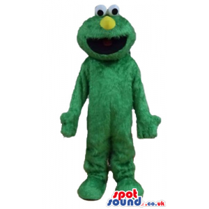 Green furry monster with a round yellow nose and round eyes -