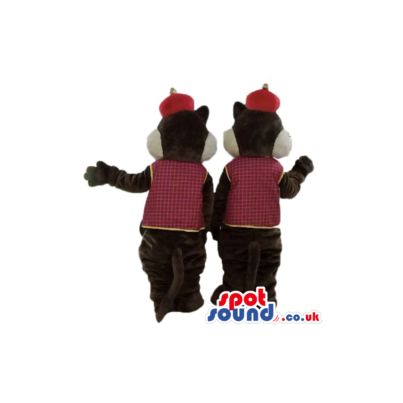 Twin brown and beige squirrels wearing a red hat and a checked