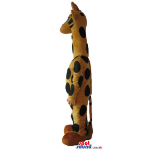 Giraffe with small blue eyes and yellow shoes - Custom Mascots