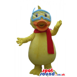 Yellow duck with an orange beak wearing a red scarf and