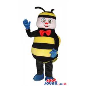 Bee with a striped black and yellow cap wearing blue gloves and