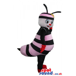 Pink and black bee with black arms and legs wearing red gloves