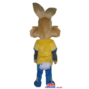 Brown rabbit wearing a black, yellow and blue shirt with an