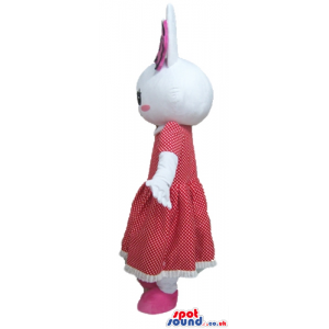 White rabbit with pink cheeks and a pink flower on the head