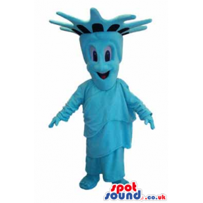 A blue smiling mascot representing the Statue of Liberty -