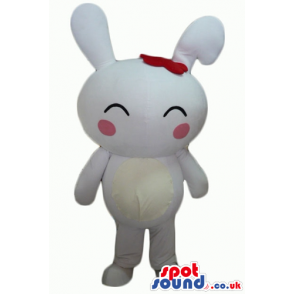 White rabbit with pink cheeks and a red bow on the head -