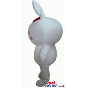 White rabbit with pink cheeks and a red bow on the head -