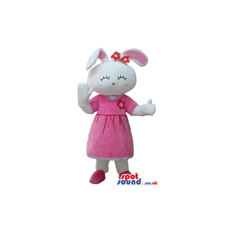 White rabbit with pink ears wearing a red flower on the head, a