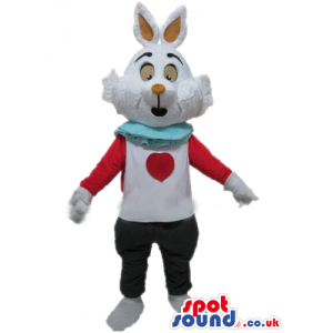 White rabbit with orange nose and ears wearing black trousers
