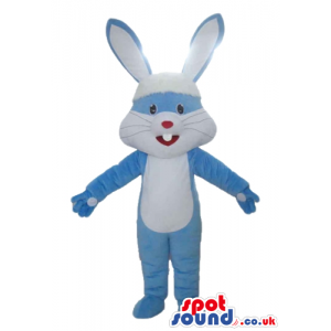 Smiling light-blue and white rabbit with a small red nose -