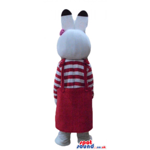 White rabbit with pink and black ears wearing a striped red and