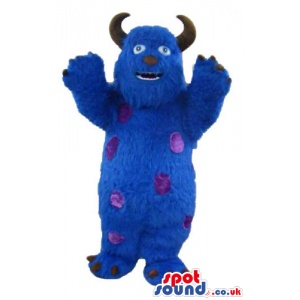 Blue furry monster with brown horns and claws and violet dots -