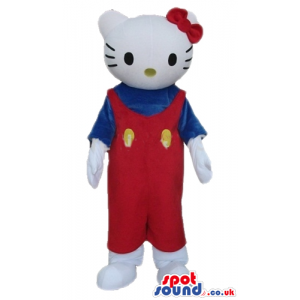 Hello kitty with a red bow wearing a blue shirt and red