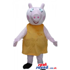 Female pig wearing an orange dress - Custom Mascots