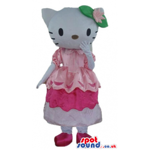Hello kitty with green and pink flower on the head wearing a
