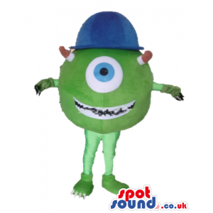 Single-eyed green monster with 2 arms and legs wearing a blue