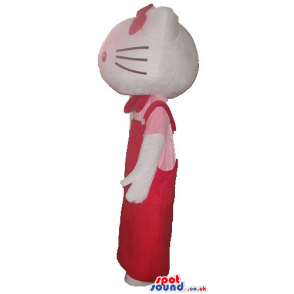 Hello kitty with a red bow on the head wearing a pink and red