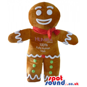 Ginger bread man decorated in white, red and green with a red