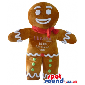 Ginger bread man decorated in white, red and green with a red