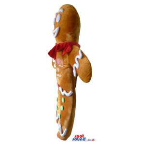 Ginger bread man decorated in white, red and green with a red