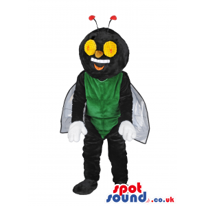 Black And Green Fly Mascot With Wings And Big Yellow Eyes. -