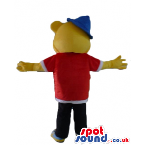Yellow bear wearing a red and white shirt, black trousers, blue