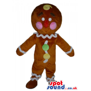 Gingerbread cookie with pink cheeks decorated in white, yellow