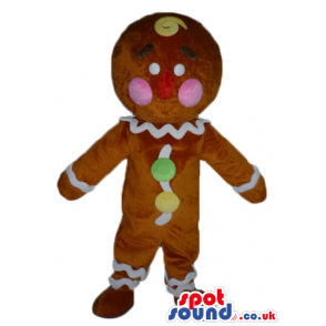 Gingerbread cookie with pink cheeks decorated in white, yellow