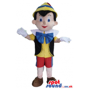 Pinocchio wearing a yellow shirt, a black vest, red trousers, a