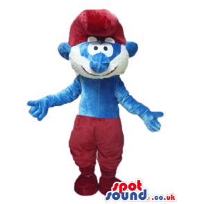 Papa smurf with a black beard, red trousers and a red hat -